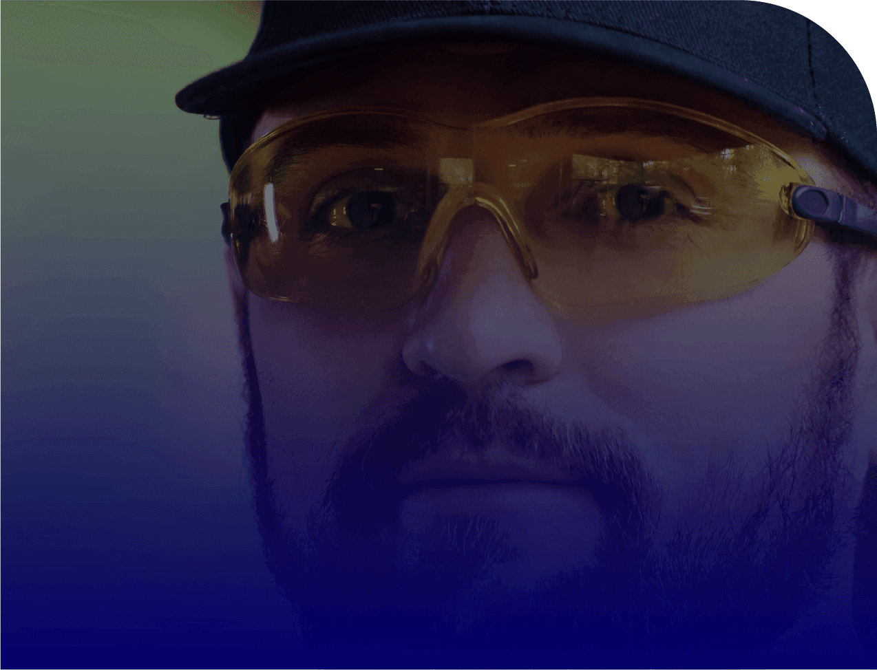Man wearing safety glasses and a cap, representing site security for Bluecircle 1st Priority service